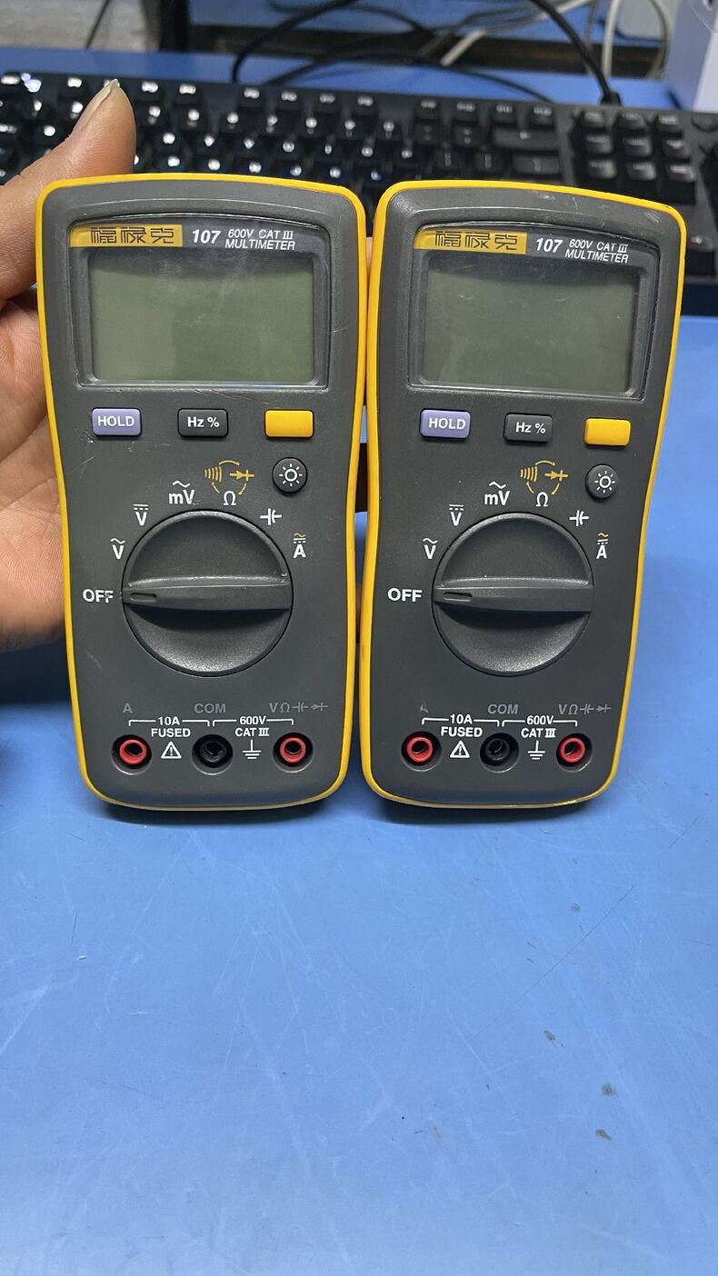 Used Fluke 107 Handheld AC/DC Digital Multimeter